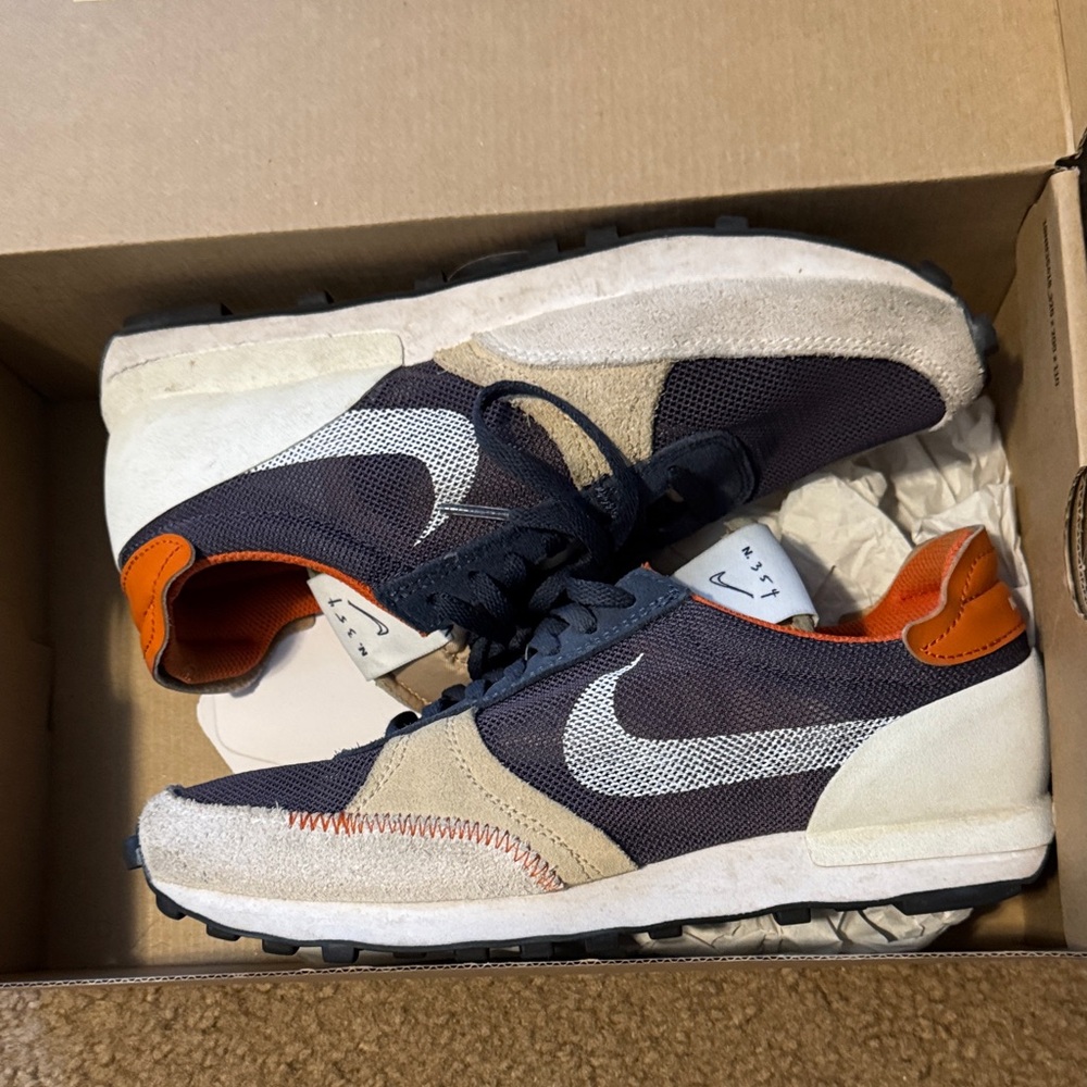 Nike Black and Beige Sneakers with Orange Accents
